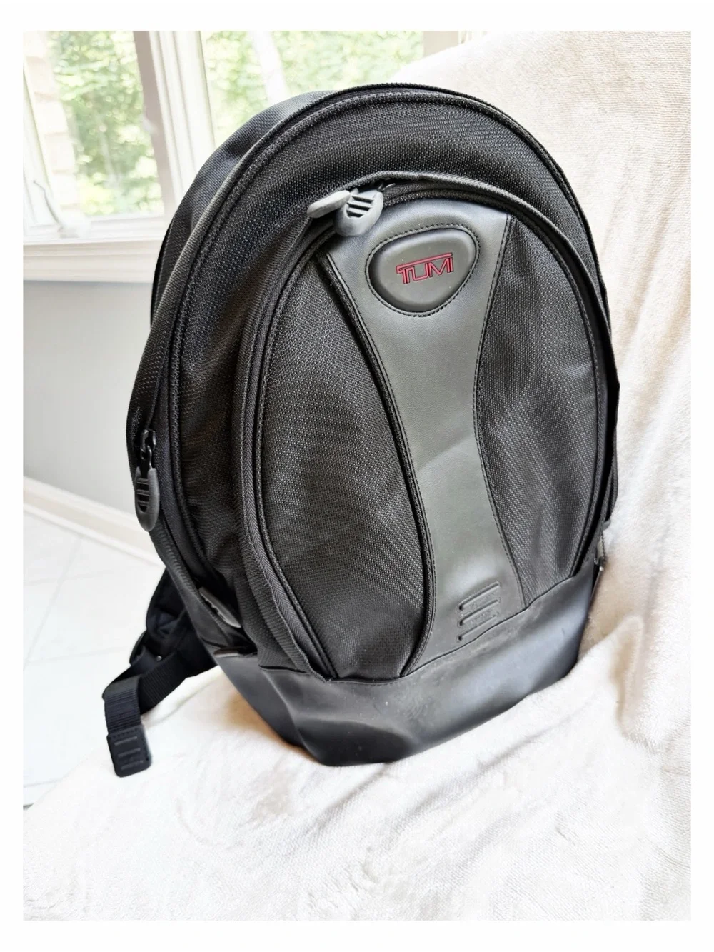 Tumi Black Backpack for Men or Women with Red Logo Accent